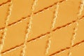 Genuine leather with rhombus stitched. Closeup on a leather texture surface with a rhombus stitch. For modern pattern