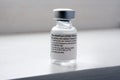 Genuine Pfizer BioNTech COVID-19 Vaccine vial. Real vaccine photo. Selective focus.