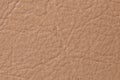 Genuine plain beige leather as background macro photo Royalty Free Stock Photo