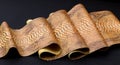 Genuine Python snakeskin leather, snake skin, texture, animal, reptile on a black background. Royalty Free Stock Photo