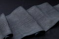 Genuine Python snakeskin leather, snake skin, texture, animal, reptile on a black background. Royalty Free Stock Photo