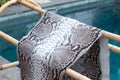 Genuine python snakeskin leather, snake skin, texture background. Swimming pool on a background. Royalty Free Stock Photo