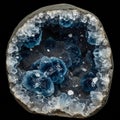 A geode showcasing a stunning interior of deep blue crystals, possibly celestite Royalty Free Stock Photo