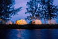 Geodesic Dome Tent Camping on Sandy Shoreline with blue sky, Relaxing by the Ocean in a Serene Camping Geodesic Dome Tent, Royalty Free Stock Photo