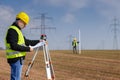 Geodesist measure land on construction site