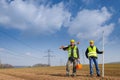 Geodesist two man equipment on construction site Royalty Free Stock Photo