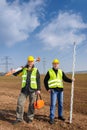 Geodesist two man equipment on construction site Royalty Free Stock Photo