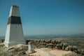 Geodetic pillar on rocky hilltop at the Castle of Monsanto