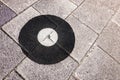 Geodetic survey marker set in a pavement.