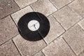 Geodetic survey marker set in a pavement.
