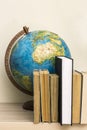 Geographic globe and books