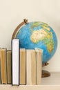 Geographic globe and books