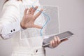 Geographic information systems concept, woman scientist working with futuristic GIS interface on a transparent screen.