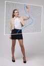 Geographic information systems concept, woman scientist working with futuristic GIS interface on a transparent screen.