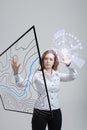 Geographic information systems concept, woman scientist working with futuristic GIS interface on a transparent screen.