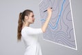 Geographic information systems concept, woman scientist working with futuristic GIS interface on a transparent screen.