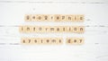 Geographic Information Systems Day.words from wooden cubes with letters photo