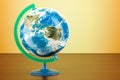 Geographical globe of planet Earth on the wooden table. 3D rendering Royalty Free Stock Photo