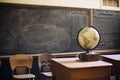 Geography class with chalkboard, books and globe. Generative AI Royalty Free Stock Photo