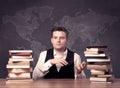 Geography teacher sitting at classroom desk Royalty Free Stock Photo