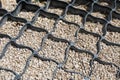 Geogrid. Geosynthetics, which is two-dimensional honeycomb structure made of strips of polyester needle-punched fabric Royalty Free Stock Photo