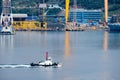 Tugboat sails pass driil ships in the Bay of Daewoo Shipbuilding and Marine Engineering DSME in Okpo city, South Korea.