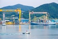 Tugboat sails pass Tideforce UK`s replenishment vessel in the Bay of Daewoo Shipbuilding and Marine Engineering DSME in Okpo