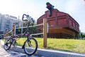 Brompton folding bike park in front of Korean traditional turtle warship Royalty Free Stock Photo