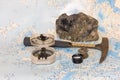 Geological fieldwork tools: hammer, compass, magnifying glass, rock samples, topographic and geological maps Royalty Free Stock Photo