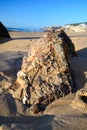 Geological formation of colorful stones with different layers, sand, fossil rocks on Magoito beach, Atlantic ocean coast near