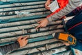 Geological gold core samples with team of mining workers measuring drilled rock top view. Selective focus Royalty Free Stock Photo