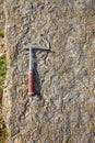 Geological hammer on the rocks Royalty Free Stock Photo