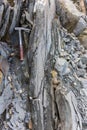 Geological hammer on the rocks Royalty Free Stock Photo