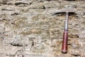 Geological hammer on the rocks Royalty Free Stock Photo