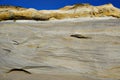 Geological landscape of steep coastal cliffs texture on the coast of D`el Rey beach in Portugal