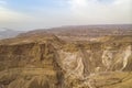 Geological rock formation in the Judean desert, Israel. Natural rock canyons and hills shot at skyscape background from Royalty Free Stock Photo