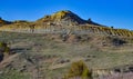 Geological stony-clay landscape, mountains and rocks in the evening at sunset. Royalty Free Stock Photo