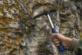 Geological hammer in hand Royalty Free Stock Photo