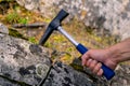 Geological hammer in hand Royalty Free Stock Photo