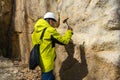 Geologist takes a rock sample Royalty Free Stock Photo