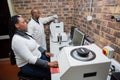 Geologists working with earth core rock samples in a lab