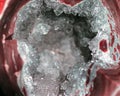 Geology of beauty. Texture of gemstone clear agate closeup as a part of cluster geode filled with rock Quartz crystals.