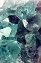 Texture of gemstone lilac Fluorite closeup as a part of cluster geode filled with rock Quartz crystals. Royalty Free Stock Photo