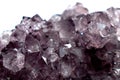 Gemstone Amethyst closeup as a part of cluster geode filled with rock Quartz crystals. Royalty Free Stock Photo