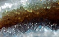 Geology of beauty. Texture of gemstone clear agate closeup as a part of cluster geode filled with rock Quartz crystals.