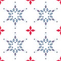 Geometric abstract snowflakes, seamless vector pattern of blue and red on white background Royalty Free Stock Photo