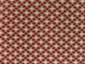 Geometric background. The rhombuses are red and white.