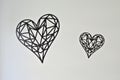 Geometric black heart wall decorations on a white background Royalty Free Stock Photo