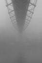 Geometric bridge disappears onto the fog