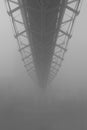 Geometric bridge disappears onto the fog